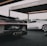 Two luxury sports cars are showcased in a modern, open garage. The foreground features a sleek black car with intricate tail light and exhaust details, while a white sports car stands in the background. The setting suggests a high-end automotive event or display.